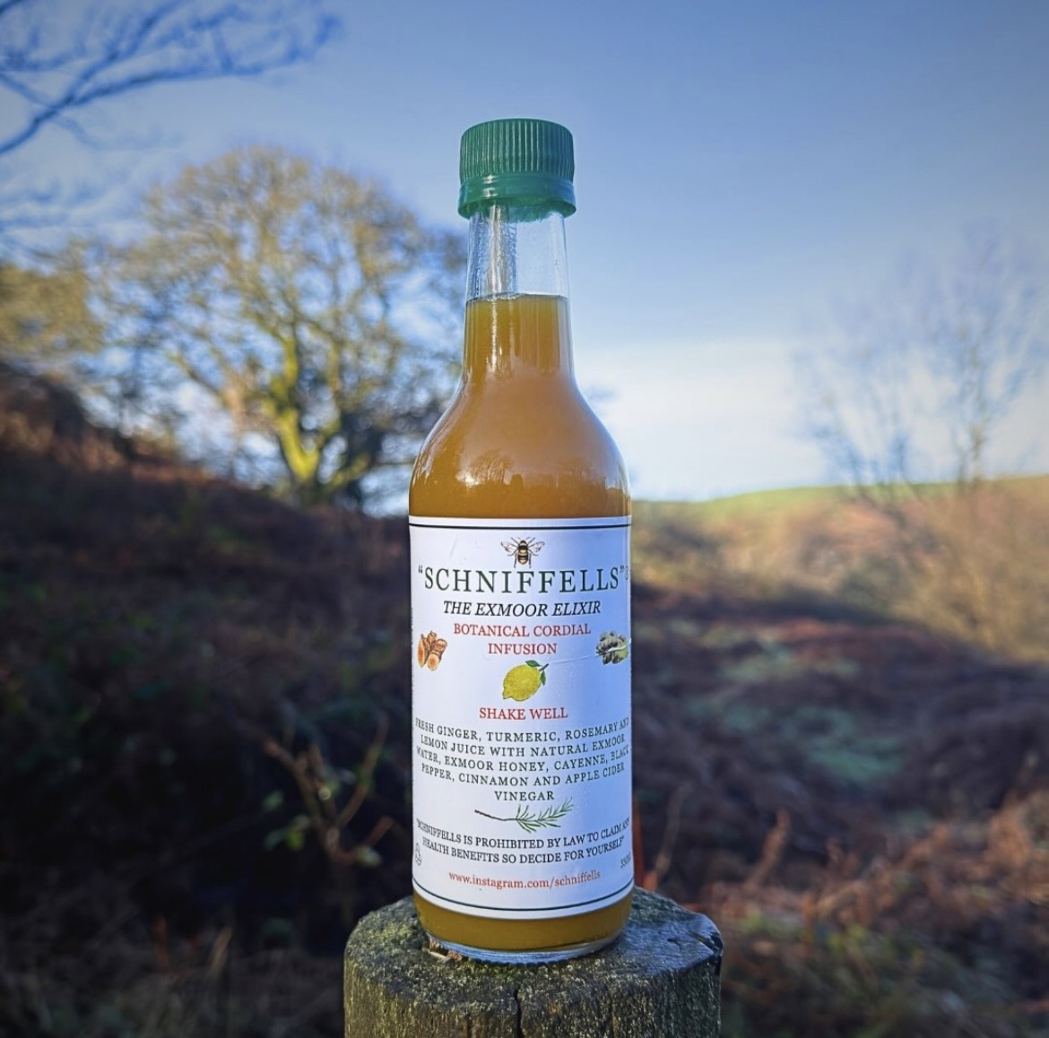 Schniffells bottle on an Exmoor fence post — 330ml amber glass with green cap